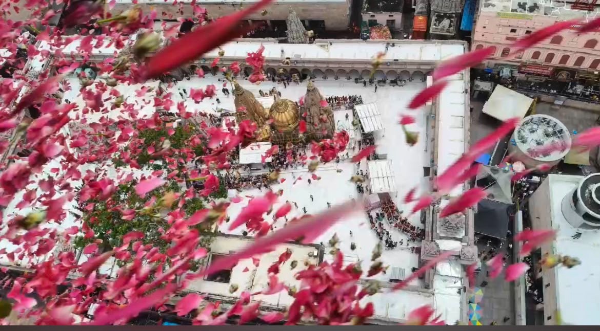 Flower petals were showered from a helicopter upon Shiva devotees in Kashi, and the sky resounded with chants of "Har-Har Mahadev."